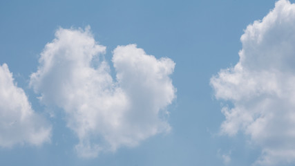 The sky has a beautiful white heart-shaped cloud.