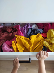 Chaos in the dresser and children's hands