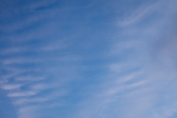 light beautiful clouds on blue sky. Soft background and texture