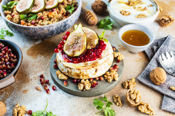 Camembert cheese with figs and honey. Selective focus. Close view