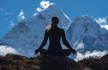 Serenity and yoga practicing at himalayas mountain range, meditation