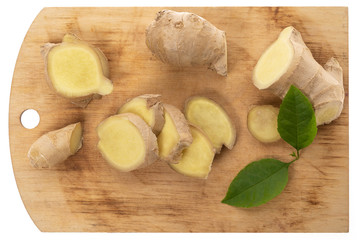 Flat lay fresh raw ginger root on a kitchen board Isolated on white background