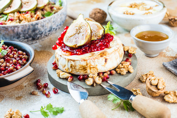Camembert cheese with figs and honey. Selective focus. Close view