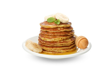 Tasty pancakes with banana and honey isolated on white background