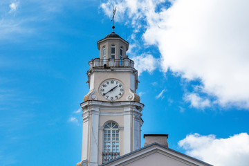 Fototapeta na wymiar Vitebsk, Belarus. Close Up Of Old Town Hall. City Hall, Clock Tower Is Famous Landmark In Sunny Day