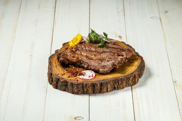 Roasted grilled beef meat steak on wooden board