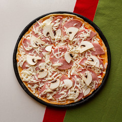 Raw pizza in a pan. Italian food cooking
