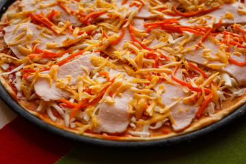 Raw pizza in a pan. Italian food cooking