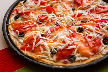 Raw pizza in a pan. Italian food cooking