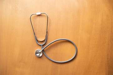 stethoscope on wood background.Flat lay with copy space.