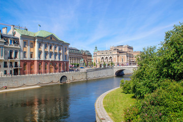 Naklejka premium center of the Scandinavian capital of Stockholm with smooth bay water, promenade, yachts and houses. Scandinavian architecture of cities.
