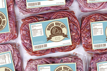 Biologically appropriate raw food for dogs or cats in packaging containing raw frozen beef meat...