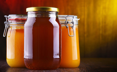 Composition with large jars of honey