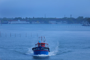 Fishing Boat Arriving To The Harbour