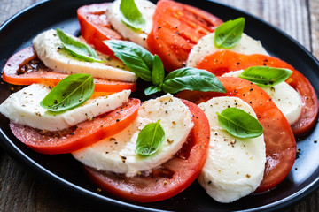 Caprese salad on wooden board
