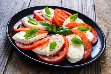 Caprese salad on wooden board

