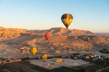 Hot air Balloons above Valley of the King in Luxor city in a morning, Upper Egypt