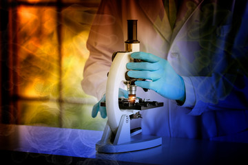 laboratory concept; Colorful shade picture of scientist uses a microscope in the laboratory