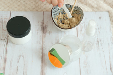 DIY cosmetics. hands in the frame create a cream of different ingredients.