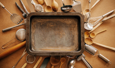 Background of kitchen utensils on wooden kitchen table. Cook. Background. Knife. Spoon. Fork. Home concept. Concept. 