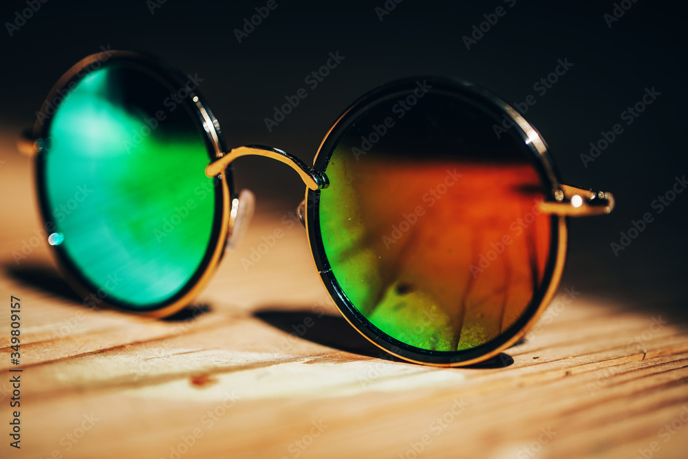 Wall mural sunglasses on wooden background. sunglasses. background. summer and travel concept.