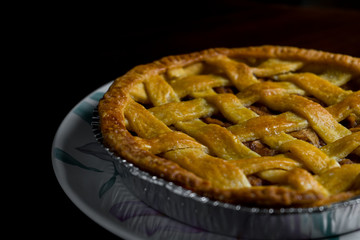 Delicious homemade pie with a crossing pattern on top of it