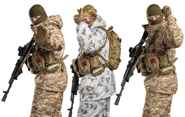 Soldier holding assault rifle and shooting. Uniform conforms to special services of the Russian Federation. Shot in studio. Isolated with clipping path on white background