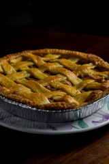 Delicious homemade pie with a crossing pattern on top of it