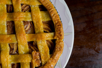 Delicious homemade pie with a crossing pattern on top of it