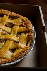Delicious homemade pie with a crossing pattern on top of it