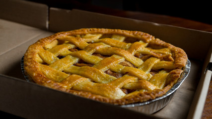 Delicious homemade pie with a crossing pattern on top of it