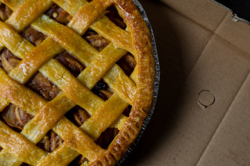 Delicious homemade pie with a crossing pattern on top of it