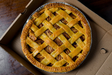 Delicious homemade pie with a crossing pattern on top of it