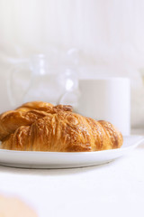 Breakfast with croissants and coffe. Empty copy space for Editor's content.