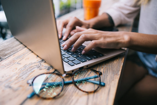 Female freelancer surfing internet while sitting outside