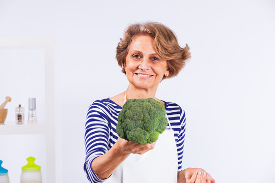 Happy Senior Woman Cooking