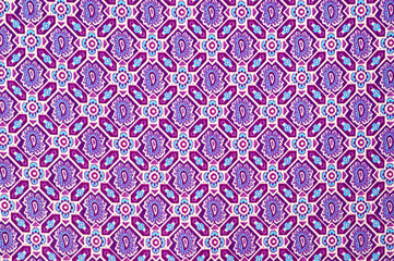 Tight stretch cotton with a bright summer print, photographed close-up.