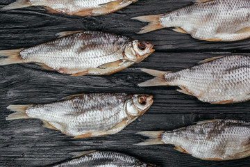 
fish on black wooden background