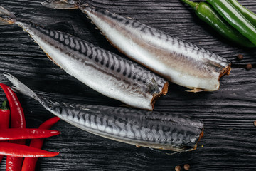 
fish on black wooden background