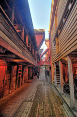 Fototapeta na wymiar Narrow small street in the historical district of wooden houses in Bergen, Norway