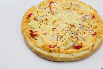 Pizza with chicken and sausage isolated on white background.
