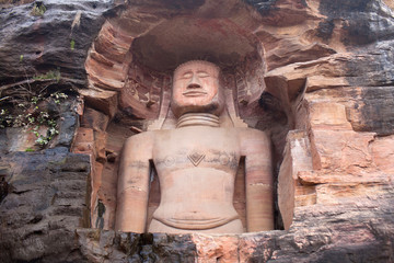 Ancient Jain statue carved out of rock at Jain temple in Gwalior, Madhya Pradesh, India