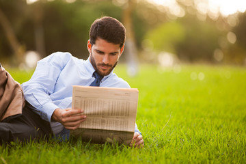 Businessman reading the newspaper