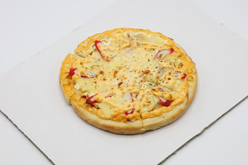 Pizza with chicken and sausage isolated on white background.
