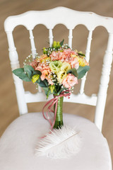 Wedding bouquet on white chair for weddings.