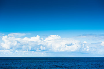 The Baltic Sea and blue sky with white clouds in sunny day