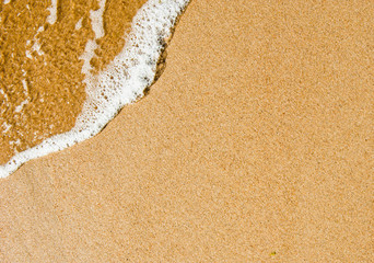 Waves and sandy beach. Sea