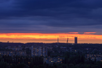 Fototapeta na wymiar Panorama of the sunset or sunrise of an industrial city in eastern Europe