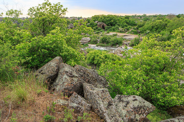 Fototapeta na wymiar Granite stones near the river canyon
