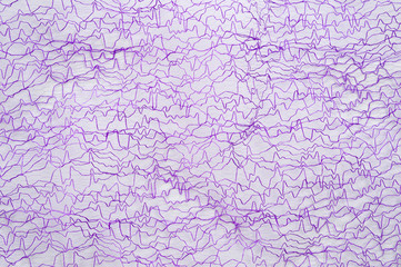 A purple guipure with satin thread, photographed in close-up. Background for the texture of outerwear and fashion.